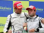 Рубенс Баррикелло (справа) и Дженсон Баттон на подиуме Гран При Испании