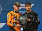 Ландо Норрис получает приз за поул из рук британского певца Луи Томлинсона, фото XPB