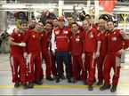 Кими Райкконен в окружении работников завода Ferrari