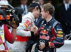 Дженсон Баттон поздравляет Себастьяна Феттеля с победой